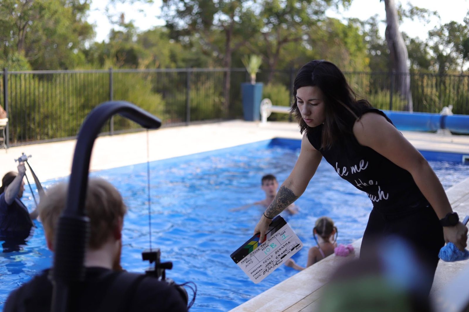 Kelly slating a pool scene on the set of Break the Surface