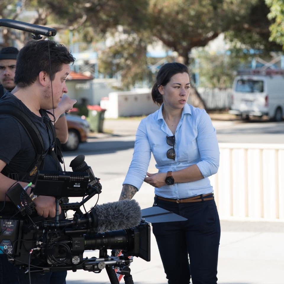 Kelly directing on a street location beside the camera rig